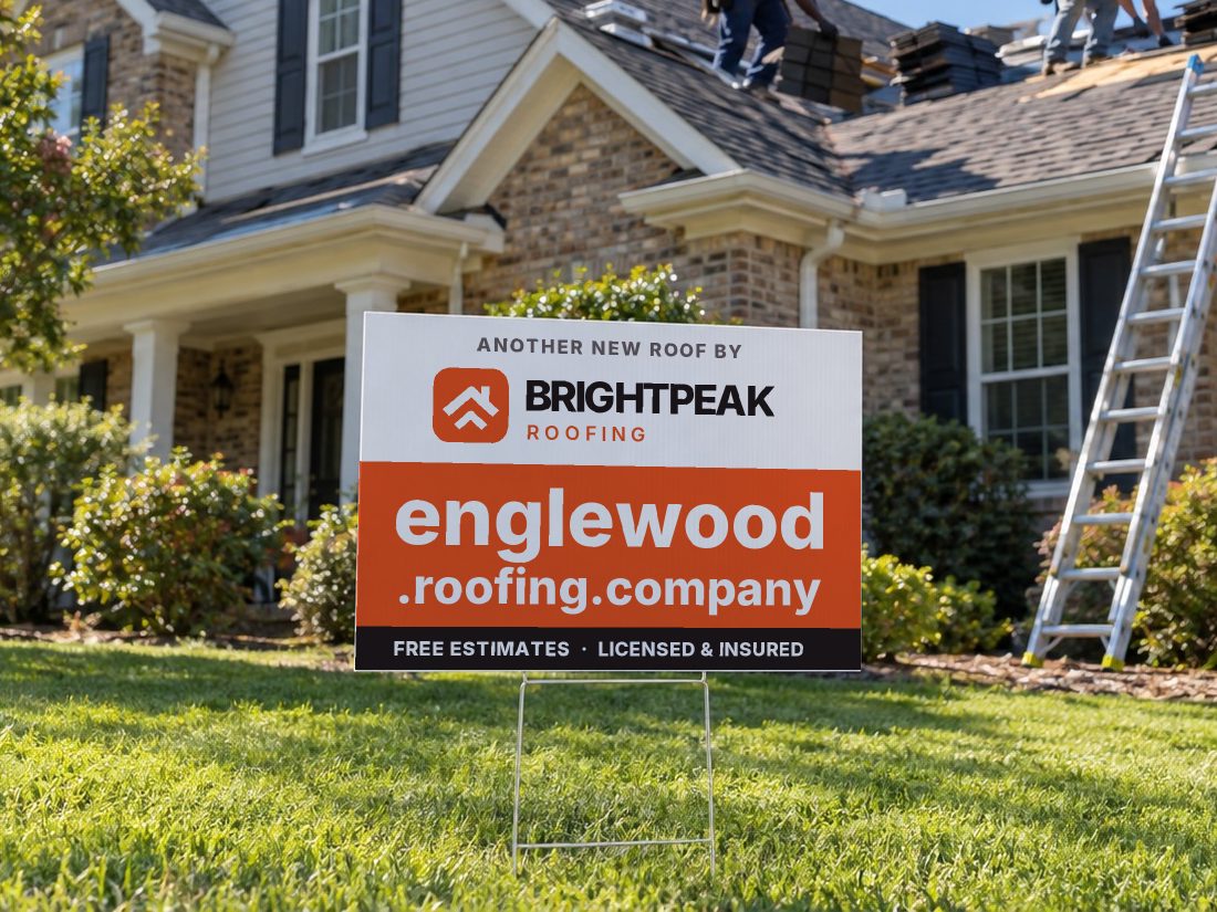 englewood.roofing.company on a yard sign in front of a house getting a new roof